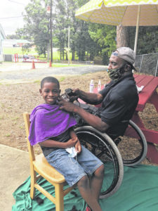 Children given free haircuts from local barber