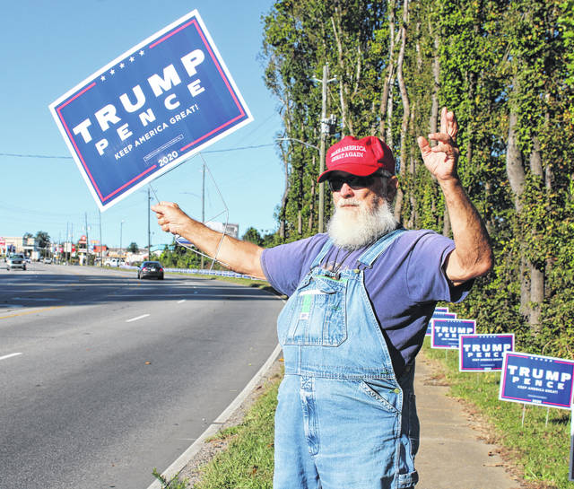 Trump supporter waves to passing cars on US 74 to draw up excitement for the 2020 Election on Oct. 30.
Liz O’Connell | Anson Record