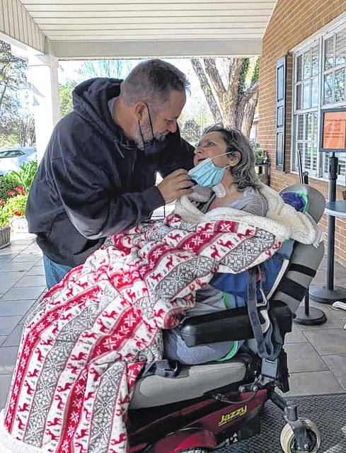 Kent and Kelli Gillis reunite for the first time since COVID-19 limited visitors at the Wadesboro Health and Rehabilitation facility.