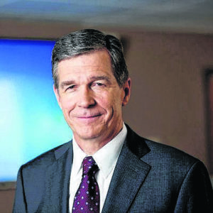 Cases rising, Cooper adds new restrictions