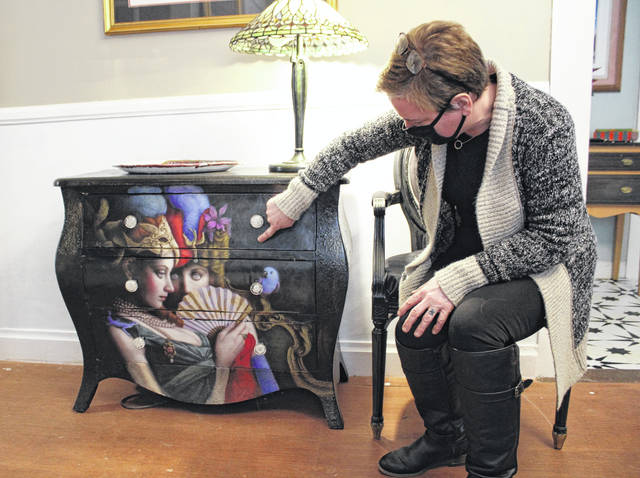 Monica Ann explains the detailing in her one of a kind pieces of art.
                                 Liz O’Connell | Anson Record