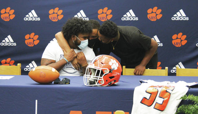 Friends congradulate Jaydn Dickens as he will continue to play football at St. Augustine College in Raleigh.
Liz O’Connell | Anson Record