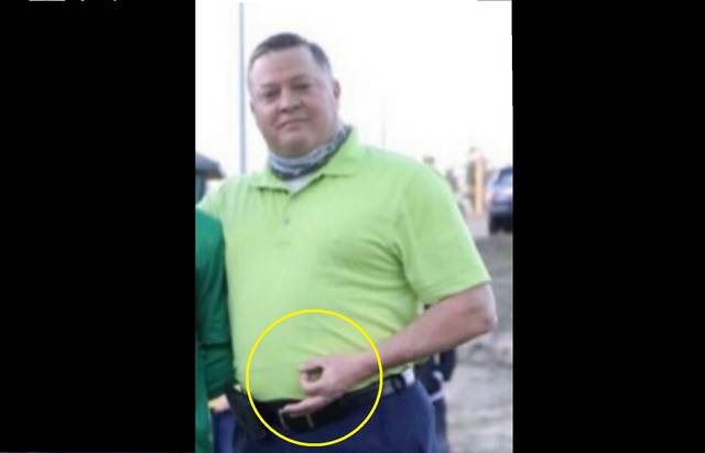 Contributed photo
Officer Thomas Luckey holds up an OK sign during a photo at his sons senior night ceremony. This symbol is considered a hate symbol by the Anti-Defamation League.