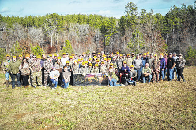 Participants, guides, and volunteers are pictured.
                                 Contributed photo