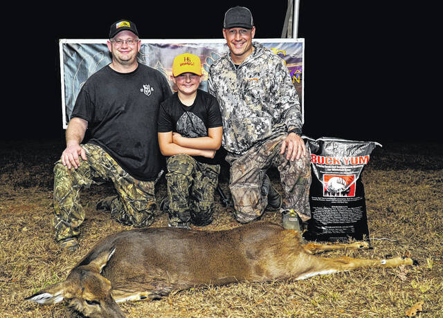 Participants show off their kills.
                                A participant shows what he shot.
                                 Contributed photo