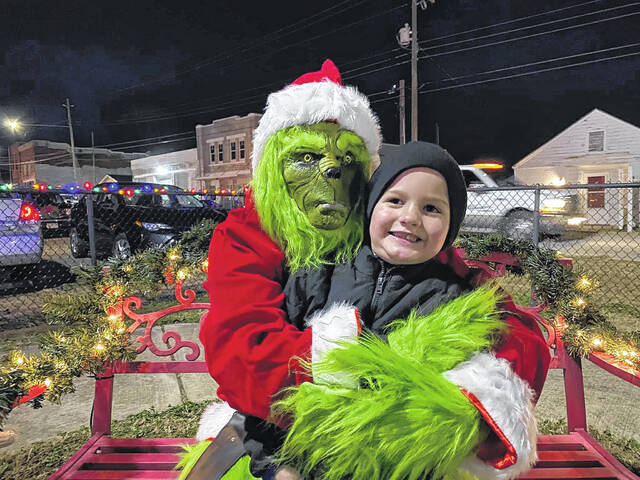 Charlie Lambert poses with the Grinch.
Contributed photo