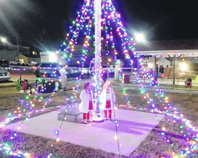 Two young girls take in the sight of the lit Lilesville Christmas from the inside.
Contributed photo