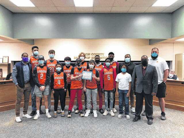 The board recognizes AMS Mens Basketball.
                                 Contributed photo