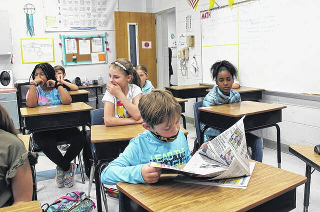 A 4th-grade student at Peachland-Polkton Elementary School reads the Anson Record during the presentation by News Editor Gavin Stone and Staff Writer Hannah Barron.
                                 Hannah Barron | Anson Record