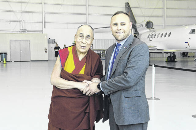 The Diplomatic Security Service provides service to foreign dignitaries, such as the Dalai Lamai. Pictured is Rockingham native Nicholas Prieto with the Dalai Lama in Salt Lake City about six years ago.
                                 Photos courtesy of US Department of State
