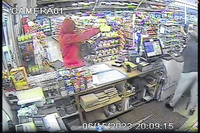 The Anson County Sheriffs Office is seeking information on an armed robbery that occurred on the evening of June 15th, 2023 at 9:45 P.M. The robbery occurred at Whits Convenience in Lilesville. Pictured is the suspect pointing a gun at the store clerk.
                                 Photo courtesy of the Anson County Sheriff’s Office