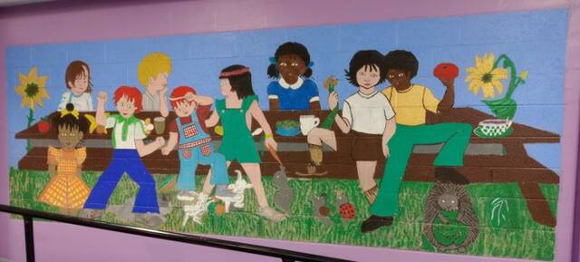 When Chambers first entered the cafeteria, he came face to face with this mural. Despite being badly damaged, Chambers saw the embodiment of all he hoped to accomplish with Oasis. Two graduates of the Overcomers program went to work bringing new life to the artwork, Vivian Sturdivant and Agnes Parker.