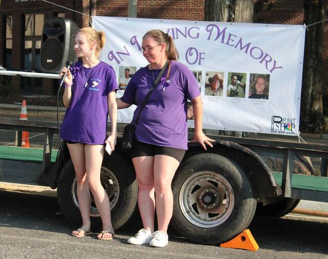 Melissa Schoonover, founder of Steves Wings, consoles Chloe Jimmerson aftter reading a heartfelt letter to her mother, April Britton, who succombed to overdose.