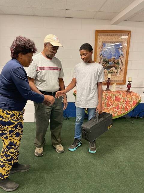 Mrs.Treamenda Caple and husband Marshall Caple presented Joshua Ingram with his first beginners trumpet.