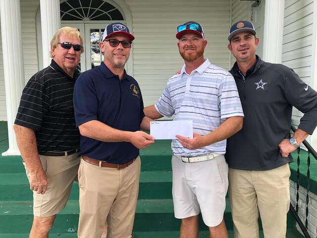 The team from SEAC of the Carolinas won the Kilwinning Lodge #64 golf tournament at Twin Valley Golf Club Oct. 27. Tournament chair Eric Forbes (second from left) presented the winnings to Dustin Horne. Other team members were Danny McRae, Tim Carpenter and Tim Horne (not pictured). Tournament proceeds will help renovate and restore Kilwinnings lodge building on South Greene Street in Wadesboro.
Submitted photo