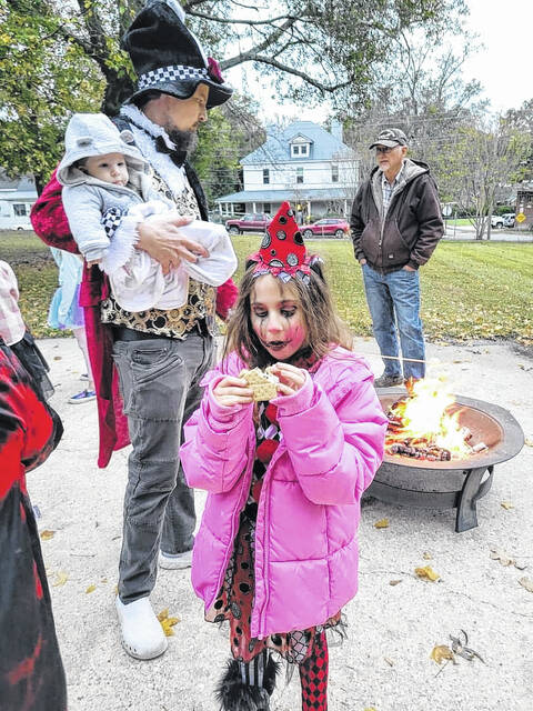 Eden Tallman took a much needed Smore break before returning to trick or treating!
                                 Photo courtesy of Laura Laney