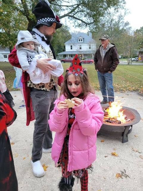 Eden Tallman took a much needed Smore break before returning to trick or treating!
                                 Photo courtesy of Laura Laney