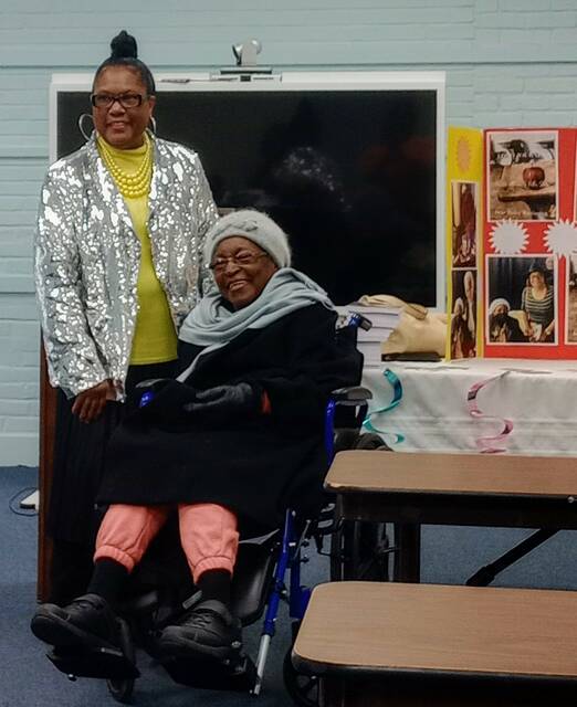 Irene Harrington takes a moment to pose with her muse, Dr. Altheria S. Patton