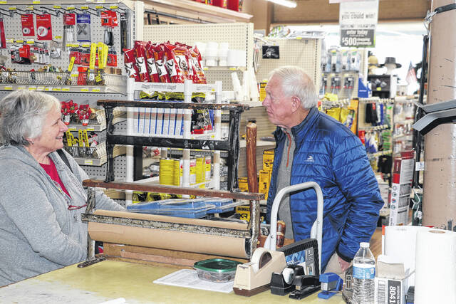 Cynthia H. Little chats with long time customer Bill Kennedy