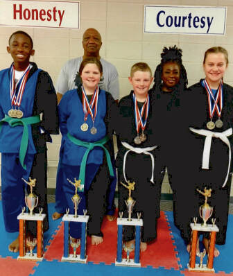 Pictured Left to Right is Dennis Boden, Addison Jarrell, Parker Brown, and Tina Andronovich. Back Row, left ot right is Master Ronnie Covington and Sensei Denise Watkins. Not pictured are Trey Garth, Christian Garth, and Lorrenzo Hubbard.
Submitted to the Record