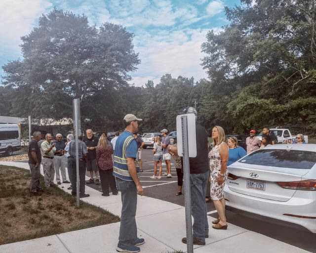 A small crowd gathers to welcome Anson Countys new ACTs building. Many attendees praise its contractors, DA Griffin Construction out of Polkton