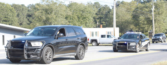 ACSOs finest, Deputies Cox, Alexson, Marsh, and Captain Beam escorted walkers throughout their route, ensuring the safety of both pedestrians and drivers during the event.
                                 Lauren Monica | Anson Record