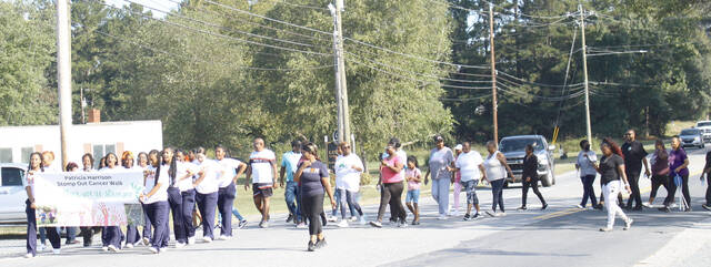 The Anson County Middle School Cheerleaders led the STOMP Out Cancer Walk. Coaches for the team are Head Coach Lasonya Clark, and Assistant Coaches; Richard Tyson Jr., Richelle Spencer and Candace Mitchell
                                 Lauren Monica | Anson Record