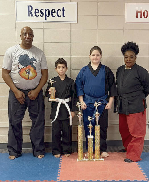 Pictured from left to right: Master Ronnie Covington, Jase Roscoe, Addison Jerrell and Sensei Denise Watkins.
                                Not pictured are Jackson Brown, Maloni Brown, Tre Garth, Jerrell Hollimon, Lorenzo Hubbard and SaMya Robinson.
                                 Contributed by Ebony Dragons Martial Arts Academy