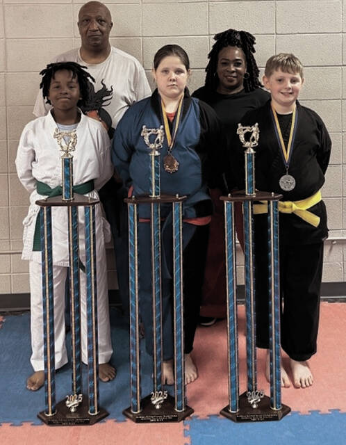Saturday, May 3, four of the Ebony Dragons traveled to Richburg, SC to compete in the Richburg National Karate Championship. Pictured from left to right are; Curtis Tre Garth, Addison Jarrell, and Parker. On the back row is MAster Ronnie Covington and Senei Denise Watkins. Not pictured is Lorenzo Hubbard. Way to go Dragons!