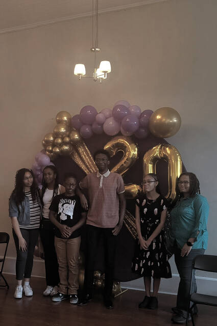 Paricipants in HOLLA!s first ever AI Winter Literacy Camp are pictured from left to right; Serenity Smith, Komori Brown, DeMyrium Tillman, Mackenzie Collins, Zaemeyuna McNeil, and Ambria Nivens. Artwork is currently on display at the HOLLA! Development Center in Morven.