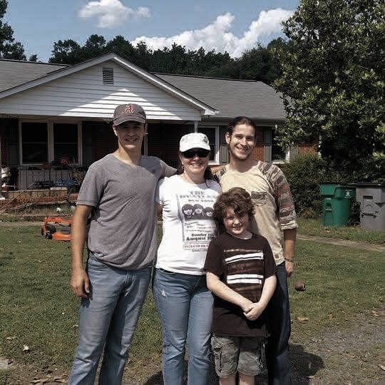 Heather with her boys; (pictured left to right) Bradley, 29, Heather, Joseph, 26, and Garrett, 18.