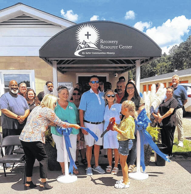 Safer Communities Ministry held a ribbon cutting for their new satellite center Wednesday; Anson Resource Reentry Family Services in Wadesboro beside Feed My Lambs on Highway 74. Darryl and Tracy Oliver watched proudly as Kara Huneycutt cut the ribbon on hope and new beginnings
Lauren Monica | Anson Record